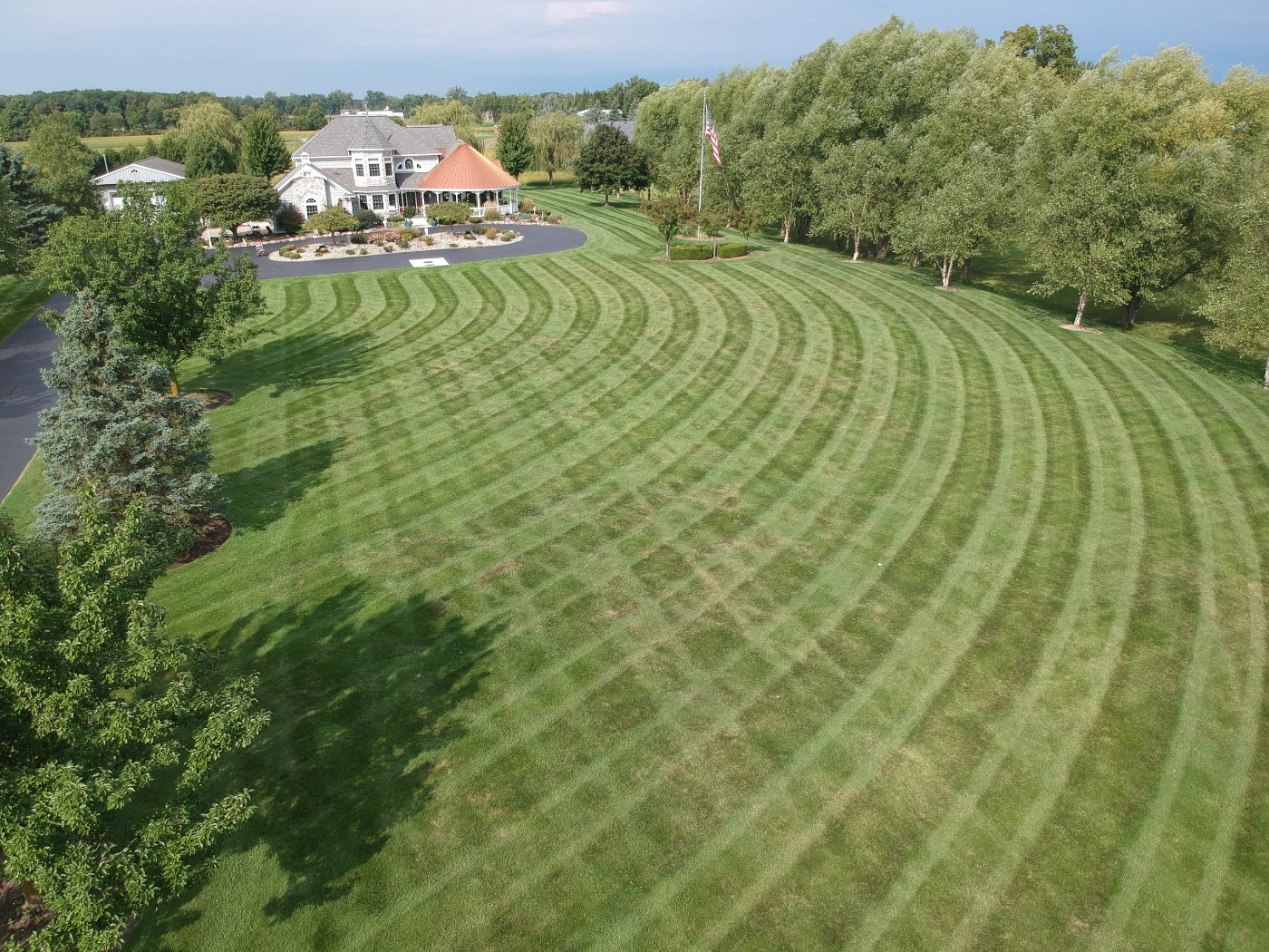 Precision mowing stripes on an estate lawn — DoctorLawn